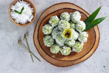 Klepon cake or ondeh ondeh is made of glutinous rice flour which is shaped like small balls and filled with brown sugar and then  rolled over grated coconut.