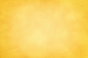 Yellow matte background of suede fabric with vignette, closeup. Velvet textile.