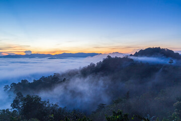Beautiful flowing clouds and the mist in front of the mountains at Khao Khai Nui in sunrise time.