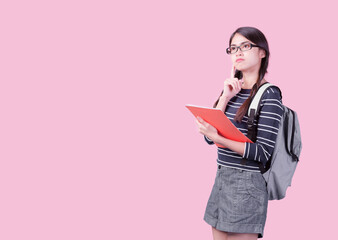 Back to school and happy time! Cute industrious child is Isolated on pink background. Kid with backpack. Girl ready to study.