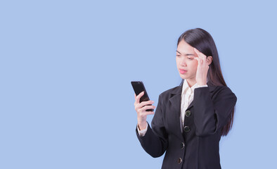 Portrait of Asian woman, happy working day.beautiful modern businesswoman ,holding mobile phon on blue background in the studio