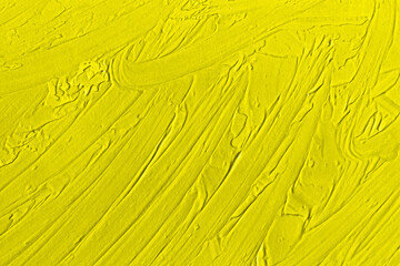 Yellow abstract texture of surface covered with putty. Grain and noise effect.  Wall background...