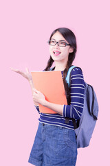 Portrait of a female student weaving two braids and wearing glasses having fun returning to school