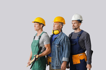 Miner men on grey background