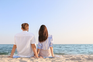 Happy young couple on sea beach