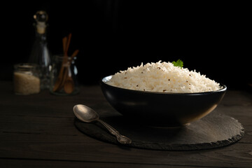 Steamed rice with Cumin  in a black bowl	
