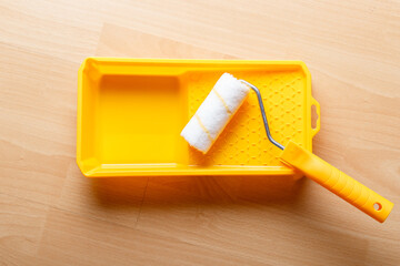 Woodworking tools. Sanding wood for smoothness and painting. Carpenter tools. Emery sponge, emery wheels, brush, roller, stain in the wooden box. Repair or renovation