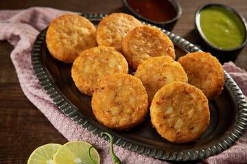 ALOO TIKKIS SERVED ALONG WITH CHUTNEYS	