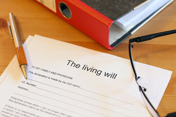 Symbol image: Blank form of the living will on a desk