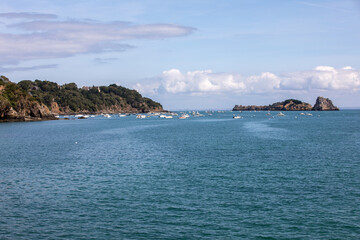  Fishing boats and yachts moored in the bay at high tide in Cancale, famous oysters production town. Brittany, France,