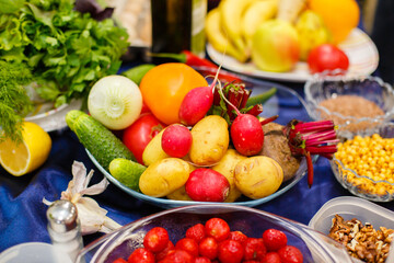 Naklejka na ściany i meble A lot of vegetables and fruits on the table. Proper and healthy food. Vibrant colors