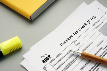 Business concept meaning Form 8962 Premium Tax Credit (PTC) with inscription on the page.
