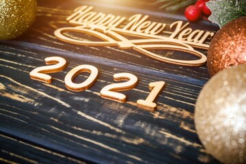 Happy new year 2021 on wooden brown background
