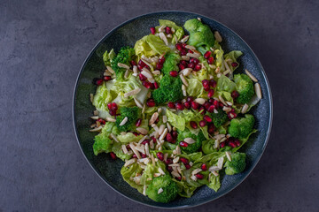 healthy tasty Broccoli salad with pomegranate on a table