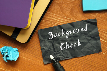 Financial concept about Background Check with sign on the sheet.
