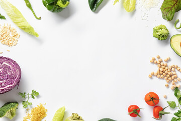 Frame from fresh vegetables and cereals on white background. Top view. Copy space