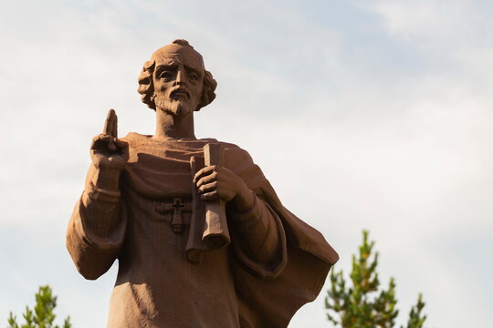 Russia Zlatoust August 2020: Monument to John Chrysostom in the Pavel Bazhov Mountain Park on a summer day.