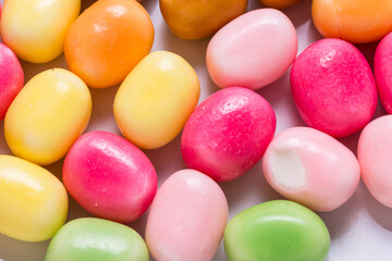 Lot of bright sweet candy, colored background
