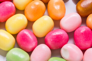 Lot of bright sweet candy, colored background