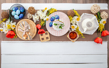 Festive table setting for Easter top view.
