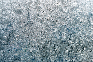Frosty natural pattern on winter window
