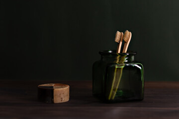 Bamboo toothbrush in glass green jar with soap. Zero waste. Recyclable