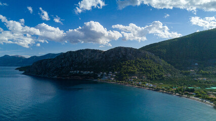 view of the sea and mountains in greece from drone