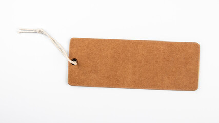 Cardboard price tag with string on a white background