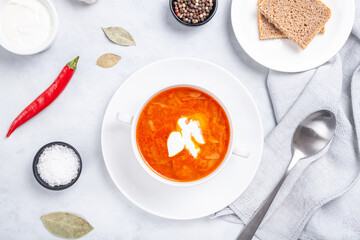 Traditional ukrainian russian soup (borscht) with bread and sour cream