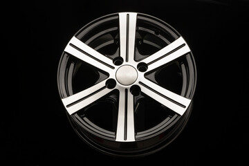 Obraz premium alloy wheel, black with polishing. front view close-up