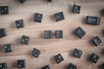 IT word on the computer keyboard buttons.