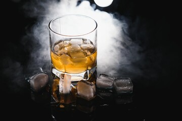 Glass of scotch whiskey and ice