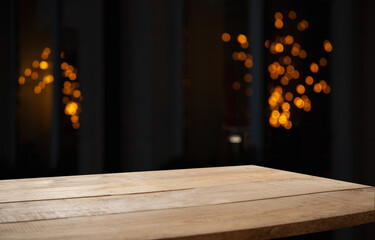 empty table on dark background with blurred lamps, cafe restaurant bokeh for your product or customization