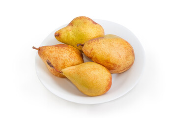 Yellow pears on dish on a white background