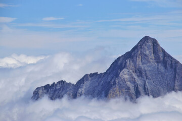 amazing view of mountain peak in above the clouds i the swiss alps 