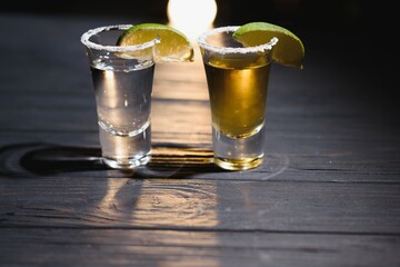 Mexican tequila with lime and salt on rustic wood background. space for text. concept luxury drink. Alcoholic drink concept.