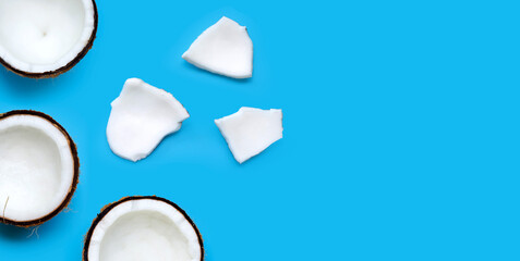 Coconuts on blue background. Copy space