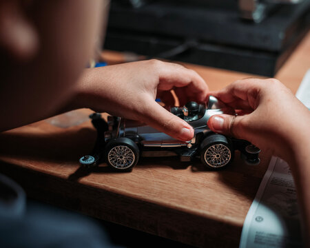 person building a car