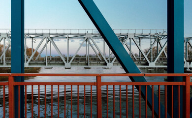 Structural elements of a railway bridge across the river. Two bridges are close by. Latvia