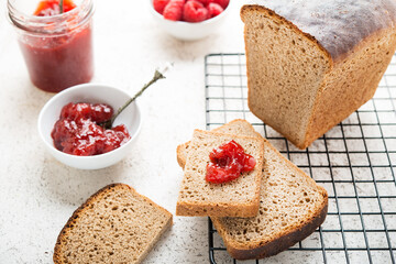 Black homemade bread with jam, selective focus