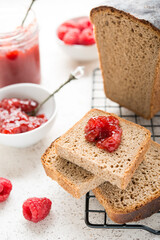 Black homemade bread with jam, selective focus