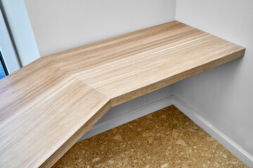 Elegant writing desk made with bleached solid oak timber mounted on white wall, upper view