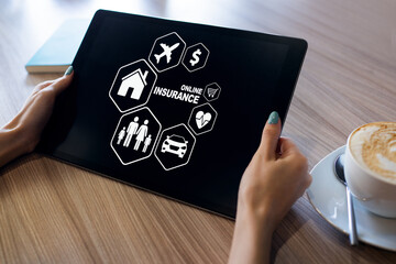 Online insurance concept. Family, life, travel and car selection buttons on screen.