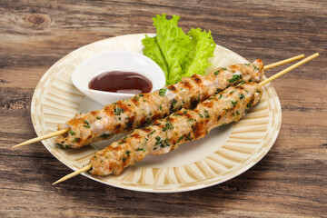 Minced pork skewer kebab with sauce