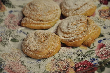 Tasty rose shaped coockies on holiday plate.Tasty rose shaped sunflower pastry.