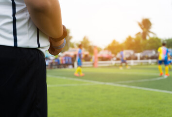 Closeup of Soccer referee  with whistle in the stadium during match.