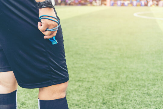 Closeup of Soccer referee  with whistle in the stadium during match. ,game official referee