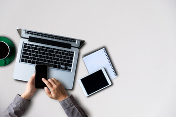 Fototapeta na wymiar Female hands working on modern laptop. Office desktop on white background