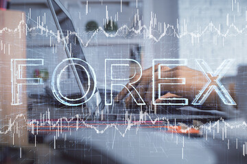 Double exposure of woman hands typing on computer and forex chart hologram drawing. Stock market invest concept.