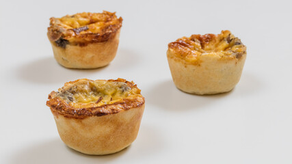 Mini cookies with flavors on white background